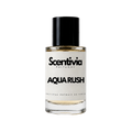 A glass bottle of Scentivia Perfumes 'Aqua Rush' Extrait de Parfum against a black background, featuring a black cap, off-white label, and golden-amber liquid