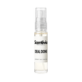 "A small, clear glass spray bottle of Scentivia Perfumes' 'Deal done' Extrait de Parfum featuring an off-white label and clear cap, set against a black background."