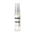 "A small, clear glass spray bottle of Scentivia Perfumes' 'First mist' Extrait de Parfum featuring an off-white label and clear cap, set against a black background."