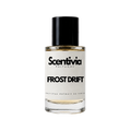 A glass bottle of Scentivia Perfumes 'Frost Drift' Extrait de Parfum against a black background, featuring a black cap, off-white label, and golden-amber liquid