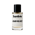 A glass bottle of Scentivia Perfumes 'Oud Velvet' Extrait de Parfum against a black background, featuring a black cap, off-white label, and golden-amber liquid
