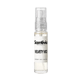 "A small, clear glass spray bottle of Scentivia Perfumes' 'Velvety vice' Extrait de Parfum featuring an off-white label and clear cap, set against a black background."