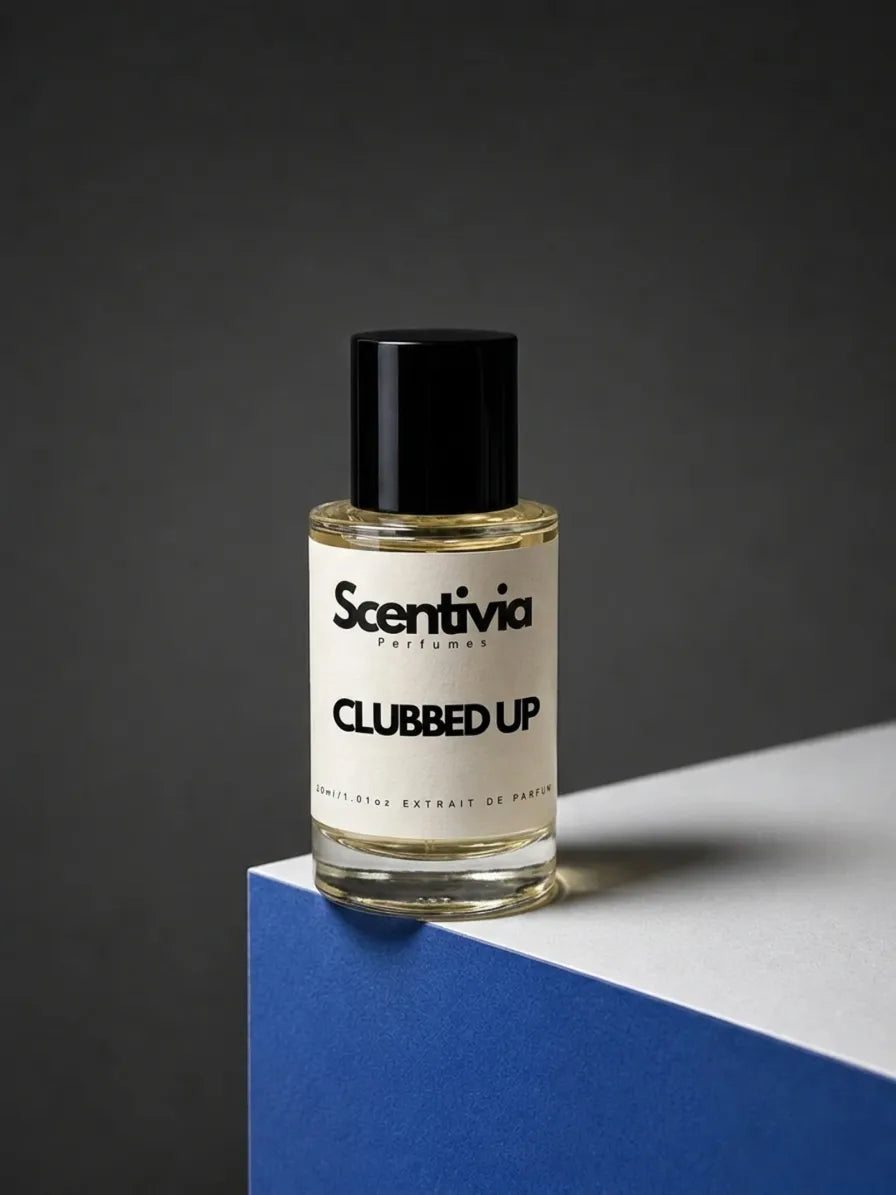 Scentivia Perfumes CLUBBED UP 30ml extrait de parfum bottle mockup showcased on a modern blue and white geometric podium setup against a dark grey studio background.